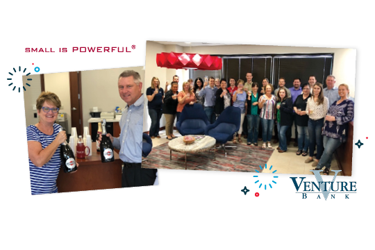 Choice Bank employees toasting with champagne.