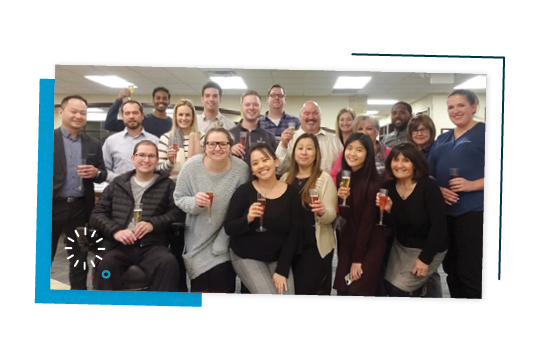 Choice Bank employees toasting with champagne.