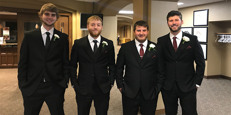 Boys in dressed in suits for an occassion.