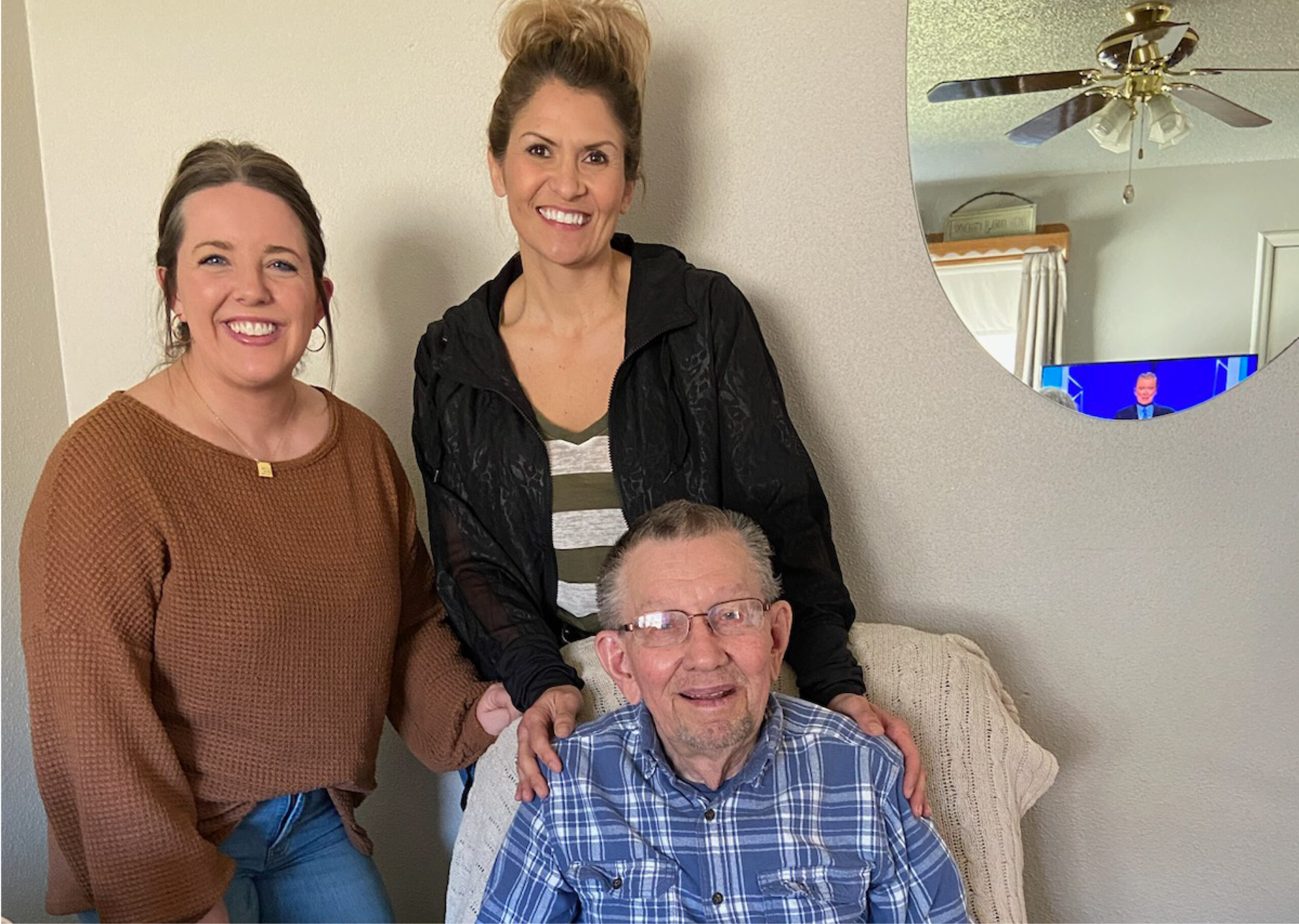 two women and an elderly man