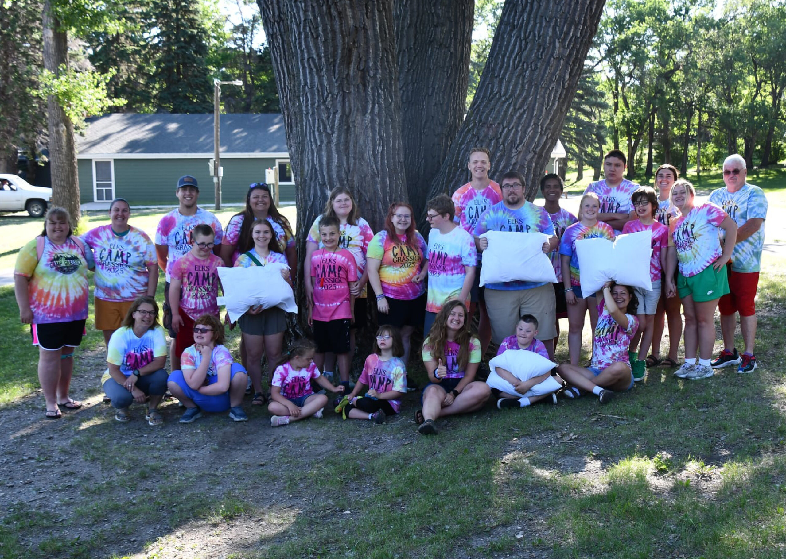 campers holding pillows